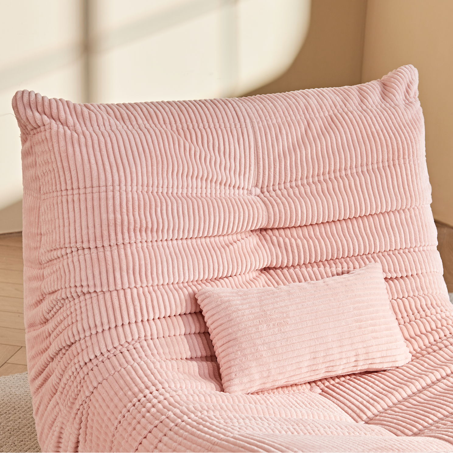 Zoovee's Pink corduroy bean bag chair and pillow zoom in view with a neutral background