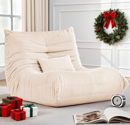 Zoovee's Beige bean bag chair with lumbar pillow in a room with Christmas decorations, including a wreath and presents.